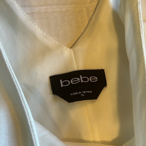 NWT-Bebe-XL-white-stretchy, adjustable straps, wrap skirt romper. Built in short - Picture 7 of 13